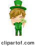 Cartoon Vector of a Happy St. Patrick's Day Boy Holding a Clovers by BNP Design Studio